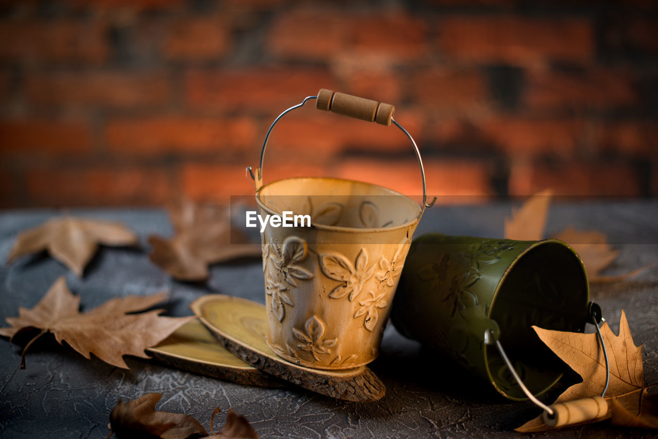 CLOSE-UP OF COFFEE CUP ON TABLE AT HOME