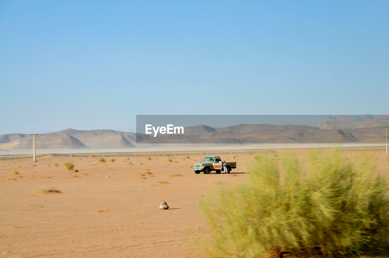 Scenic view of desert against clear sky