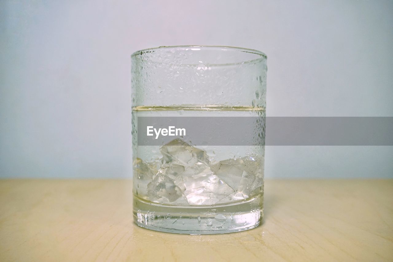 CLOSE-UP OF DRINK ON TABLE