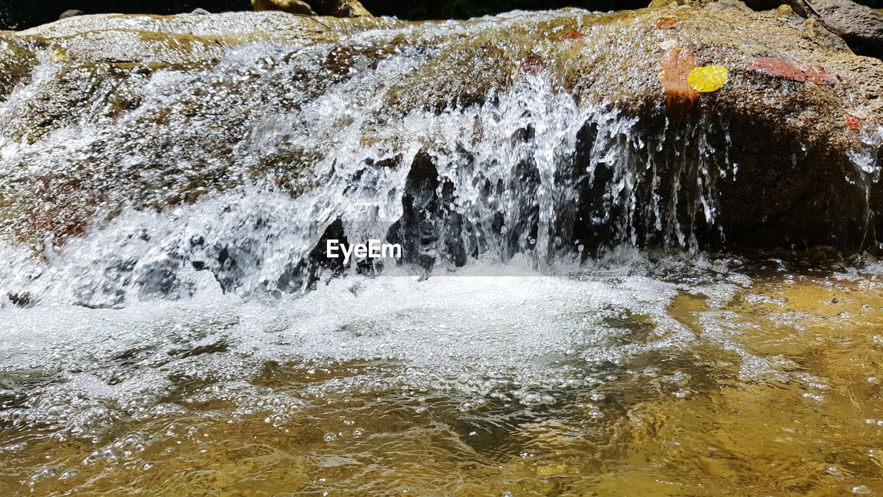 CLOSE-UP OF WATER SPLASHING IN SHALLOW