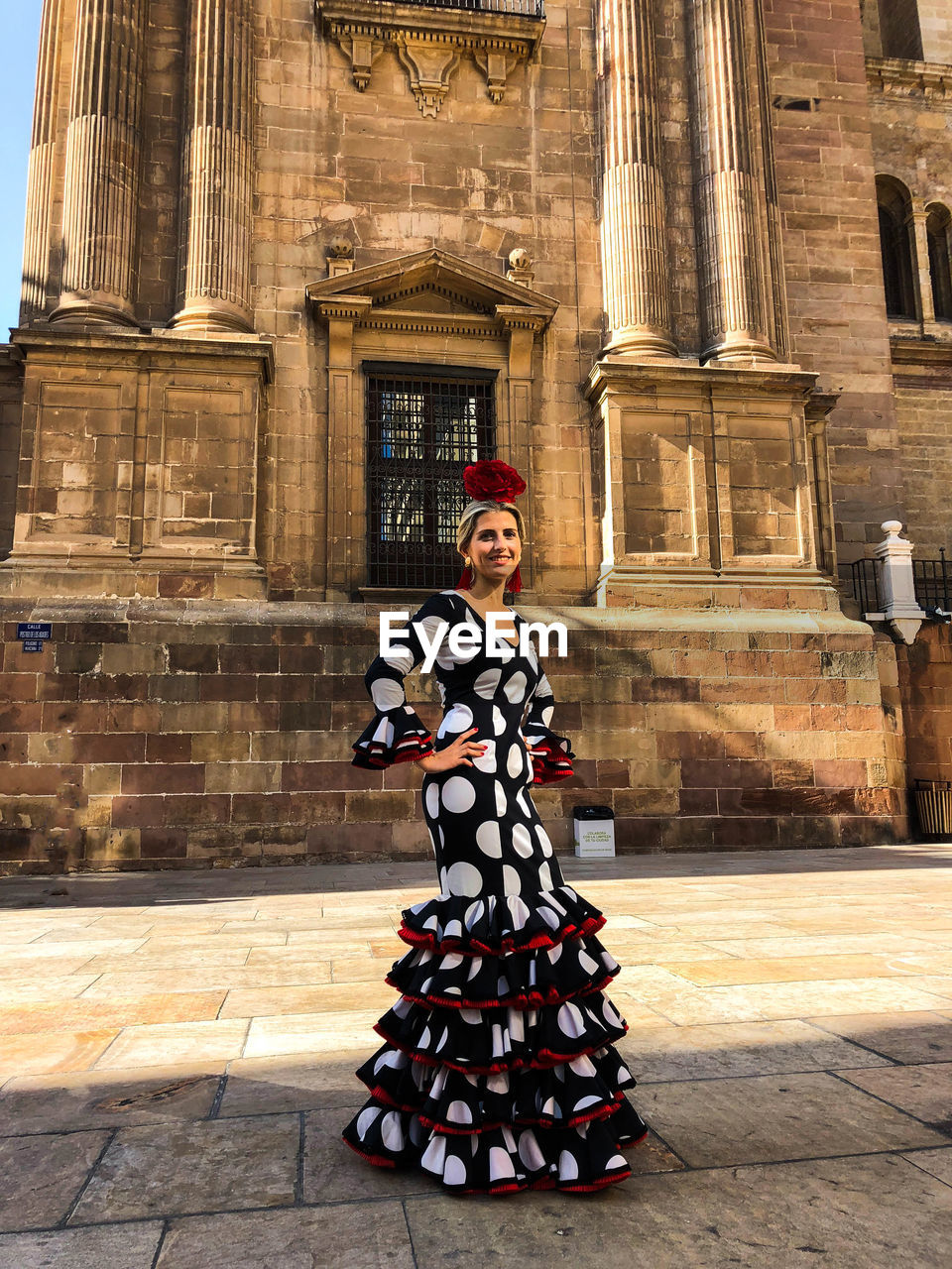 Full length of woman standing outside building