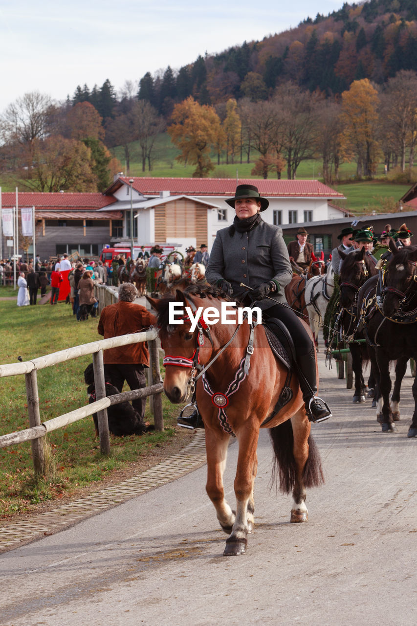 MAN RIDING HORSE CART