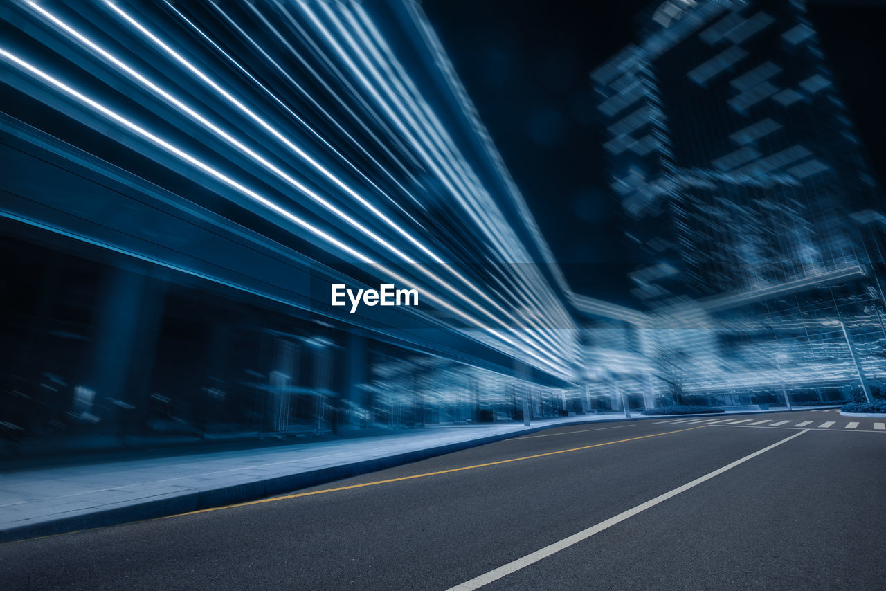 Light trails on road in city at night