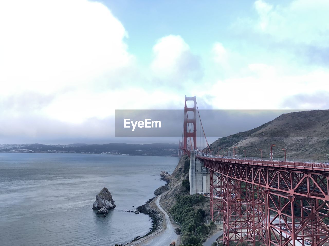 Golden gate bridge against cloudy sky