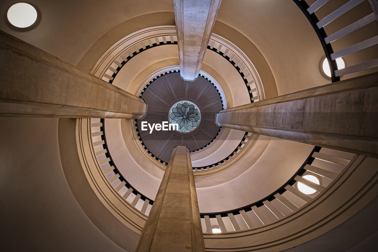 Low angle view of spiral staircase in building