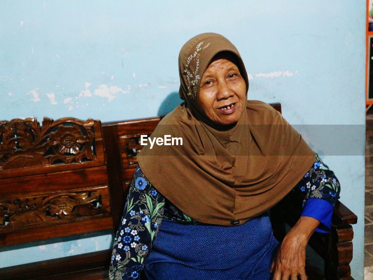 Portrait of senior woman sitting at home