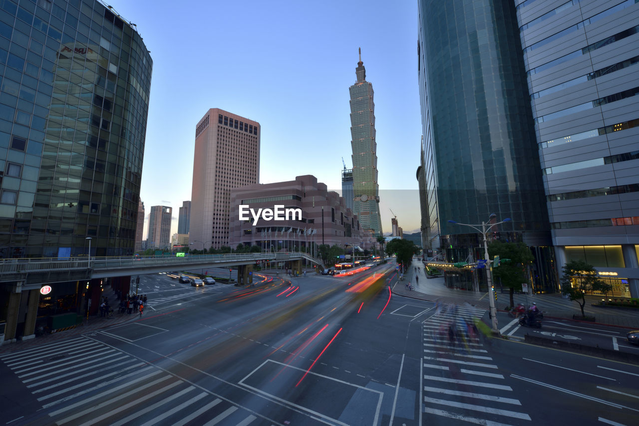 View of skyscrapers in city against clear sky