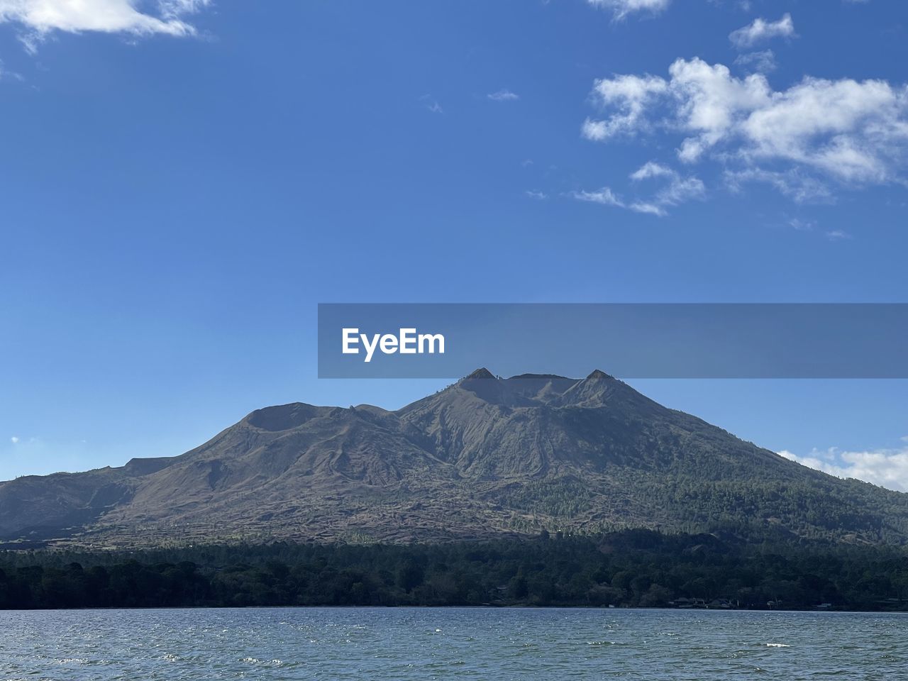 VIEW OF VOLCANIC MOUNTAIN AGAINST SKY