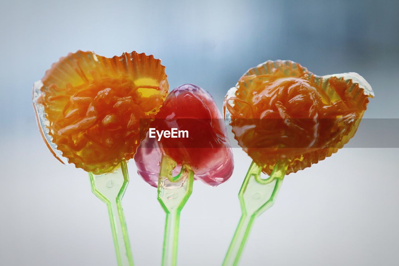 Close-up of heart shape jelly in forks