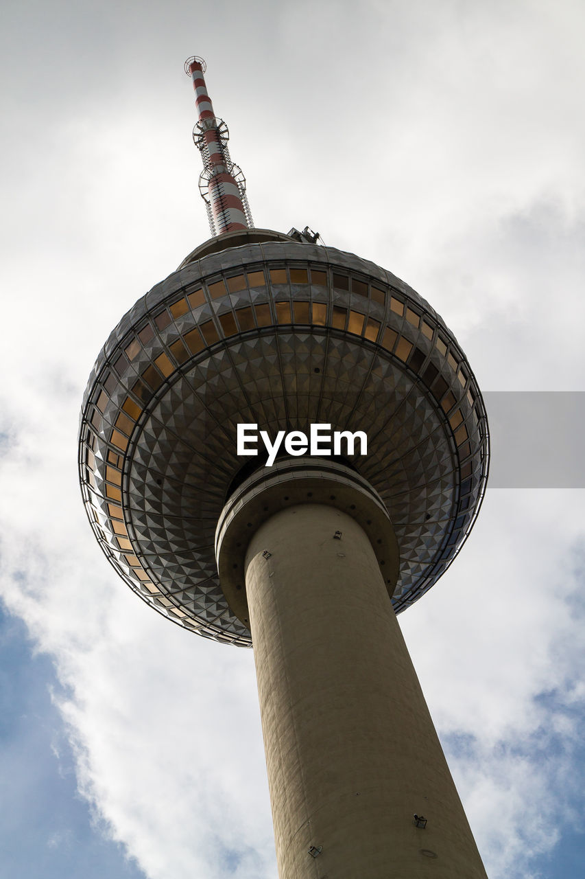 Low angle view of tower against cloudy sky