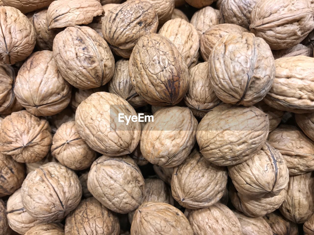 Full frame shot of whole walnuts