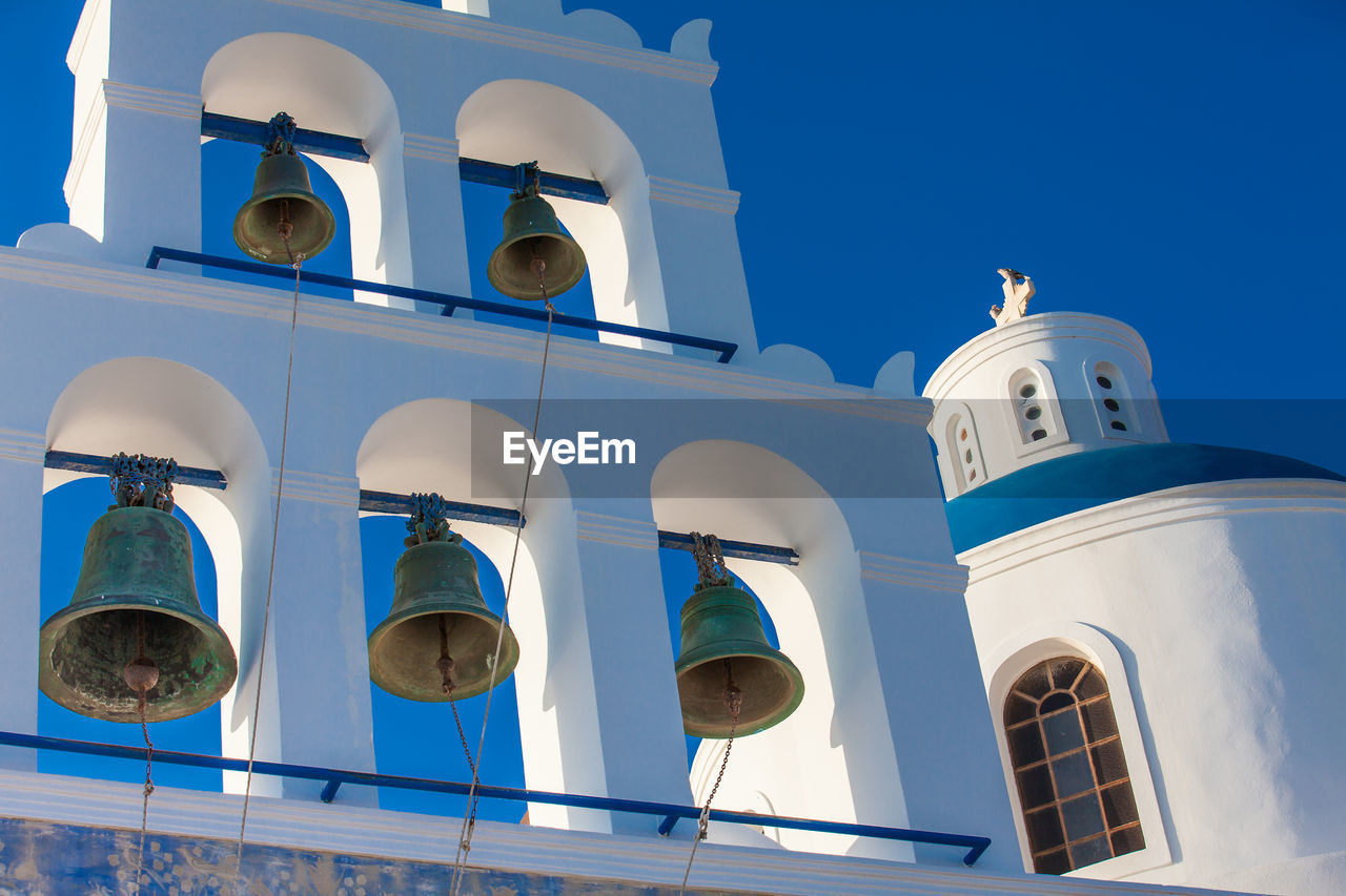 Dome and bell tower of the church of panagia platsani located in oia city at santorini island