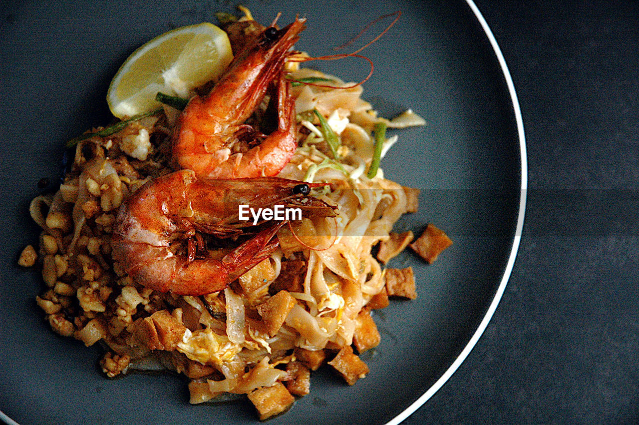 High angle view of pad thai in bowl on table