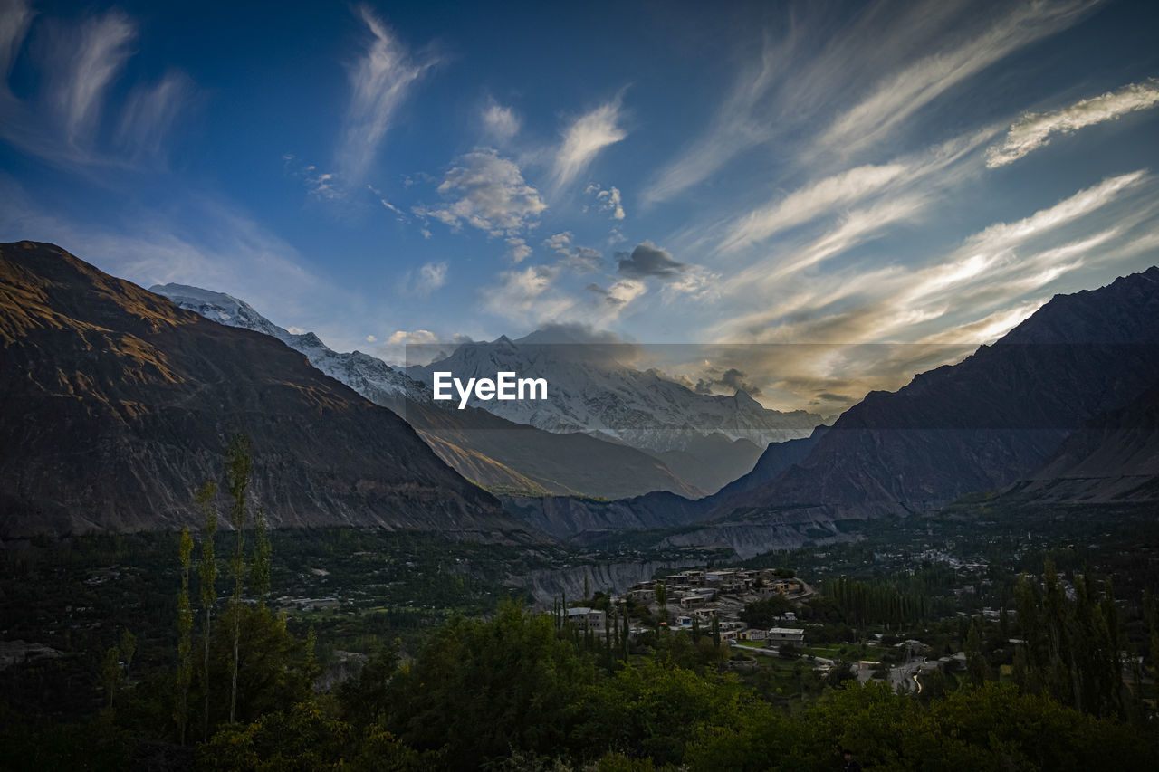 Scenic view of landscape and mountains against sky