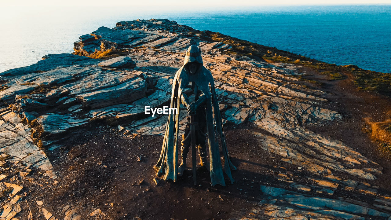 water, sea, ocean, land, coast, nature, beach, scenics - nature, terrain, sky, beauty in nature, rock, no people, cliff, day, environment, outdoors, tranquility, travel destinations, horizon over water, blue, travel, non-urban scene, landscape, high angle view, horizon, wave, tranquil scene