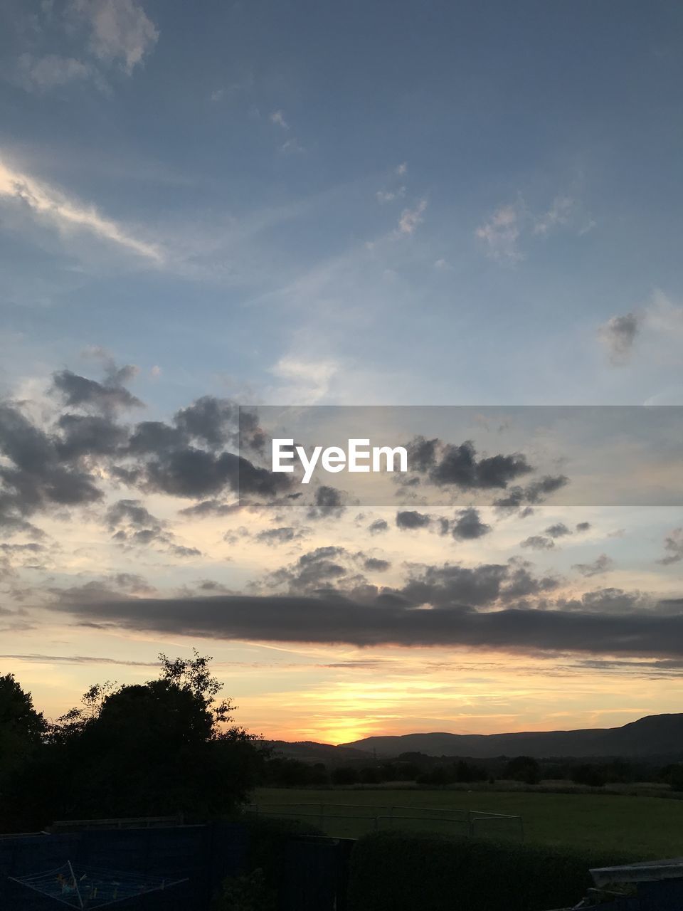 SCENIC VIEW OF SILHOUETTE LANDSCAPE AGAINST SKY DURING SUNSET