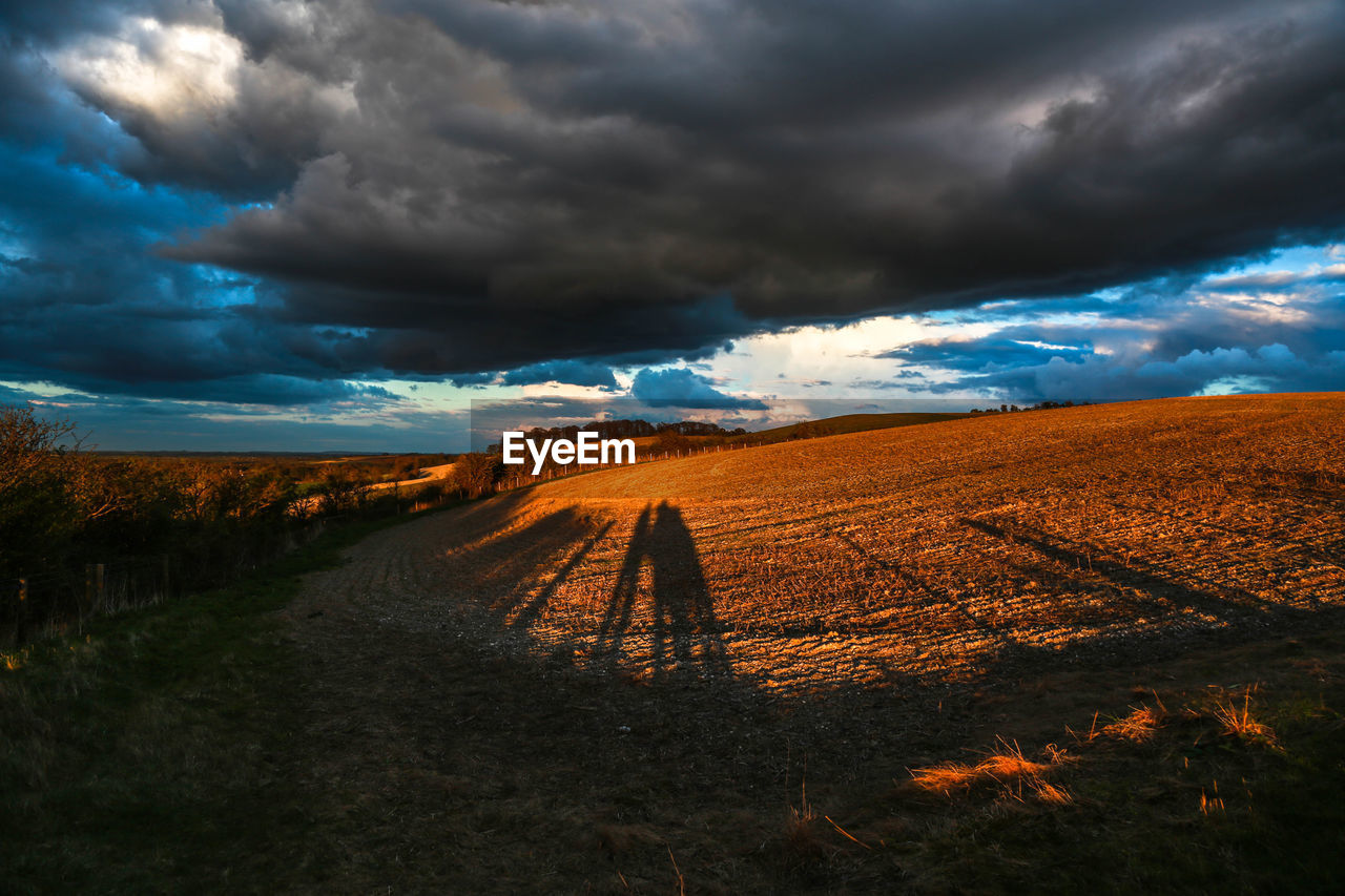 Scenic view of dramatic sky over landscape