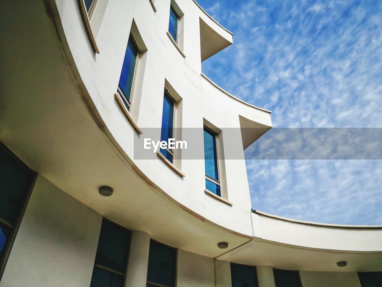 Low angle view of modern building against sky