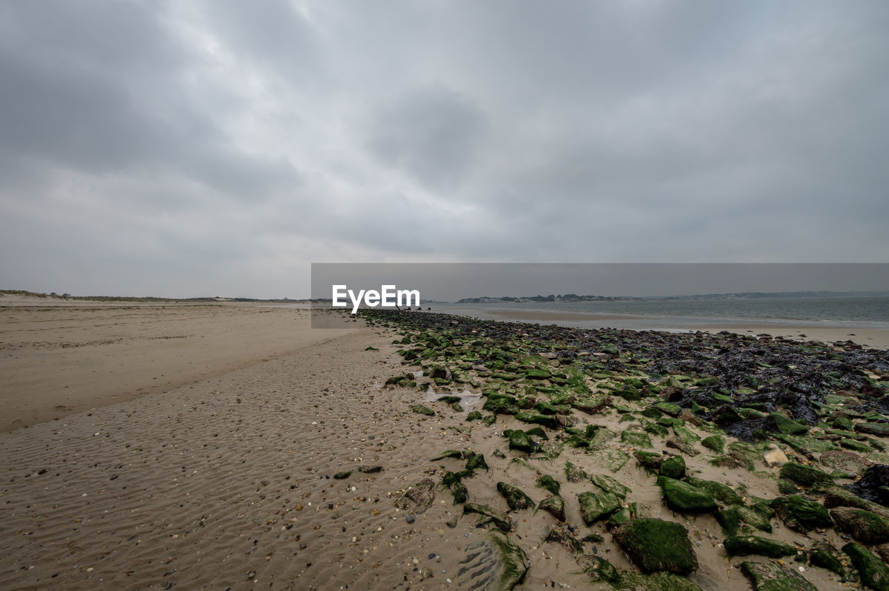 BEACH AGAINST SKY