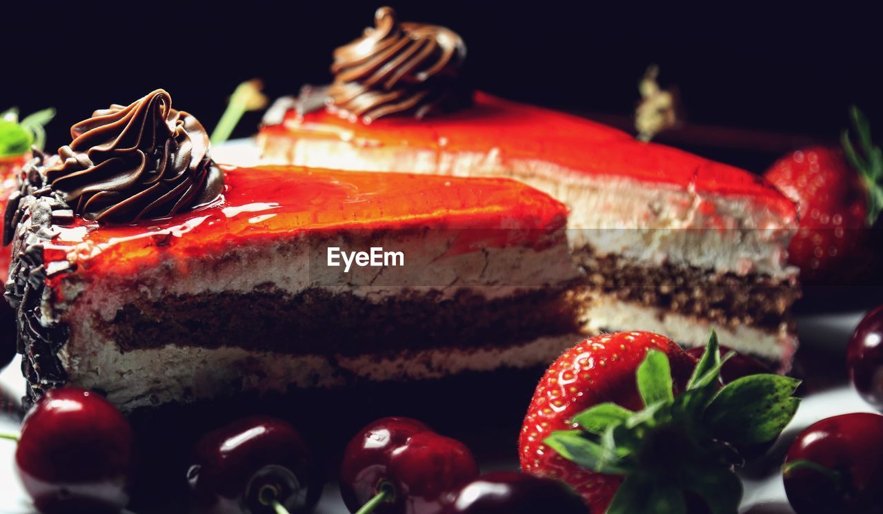 CLOSE-UP OF CAKE ON STRAWBERRY