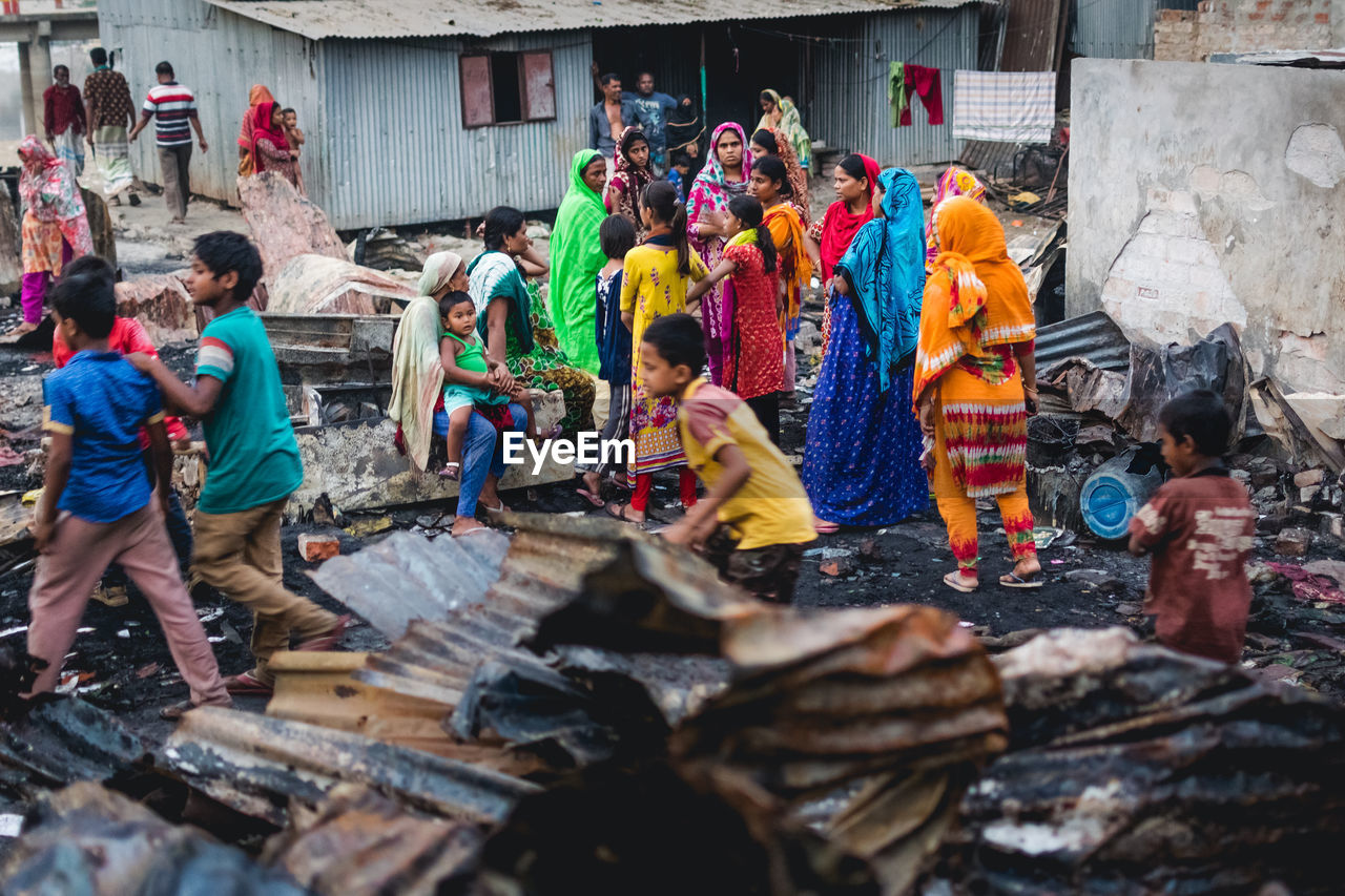 GROUP OF PEOPLE IN TRADITIONAL BUILDING