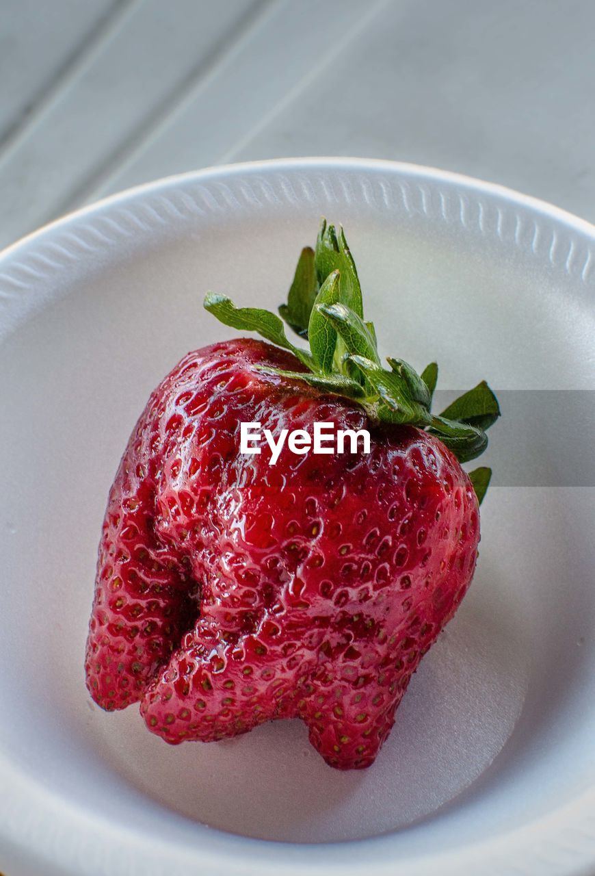 Close-up of strawberry in bowl on table