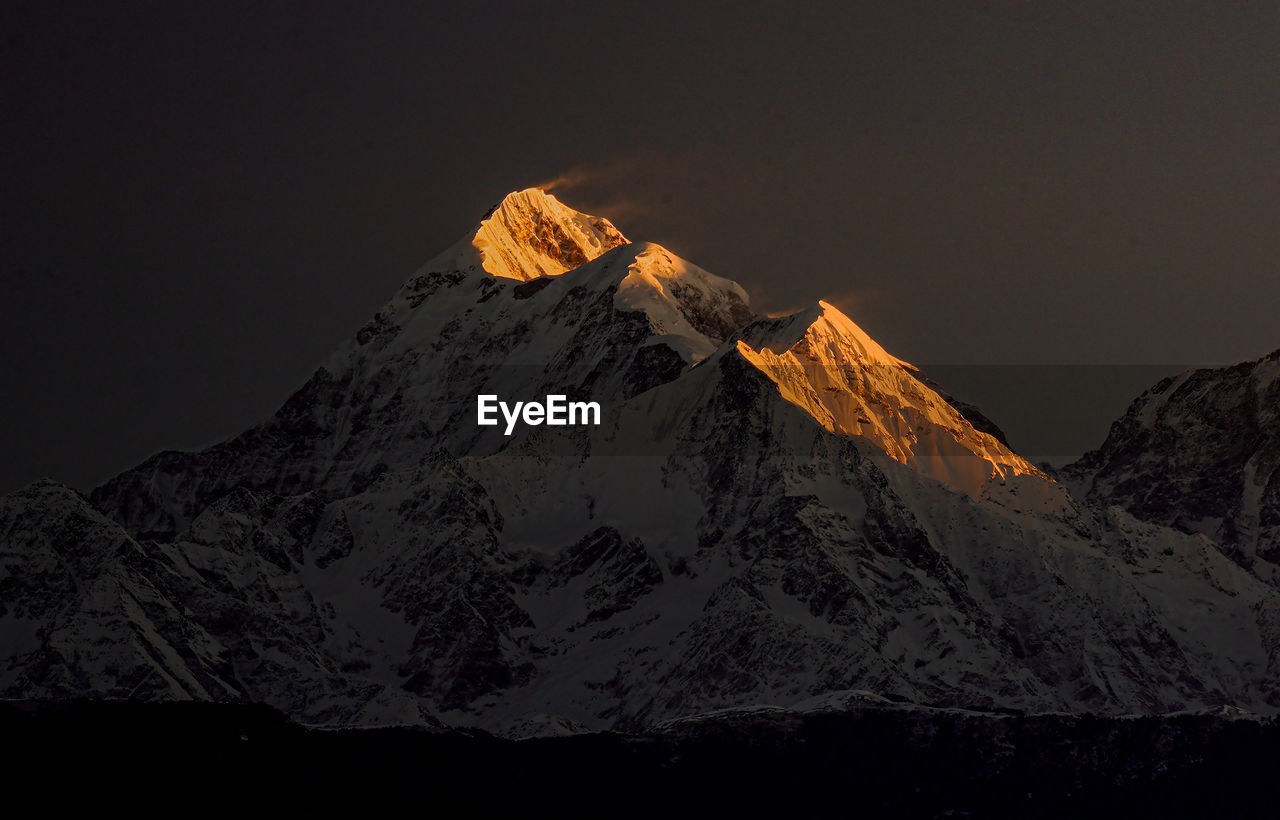 Sunrise on trishul peaks 