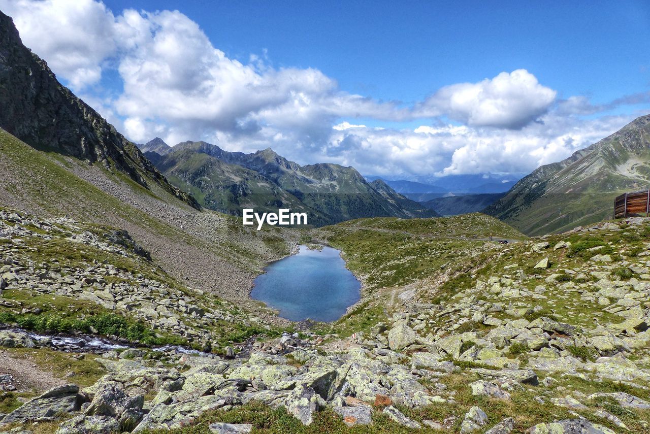 Scenic view of landscape and mountains against sky