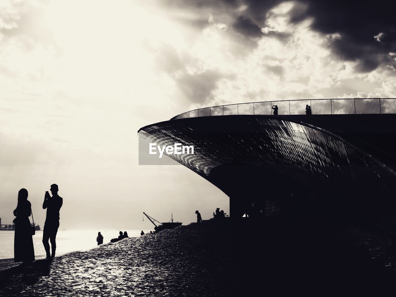 PEOPLE STANDING AT BEACH