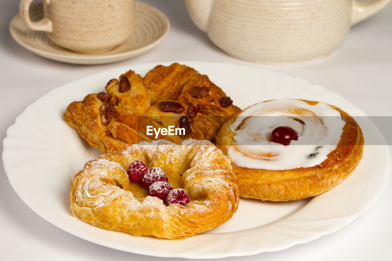 High angle view of danish pastries in plate on table