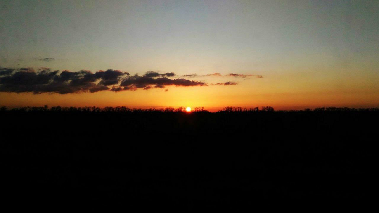 SILHOUETTE LANDSCAPE AGAINST ROMANTIC SKY AT SUNSET