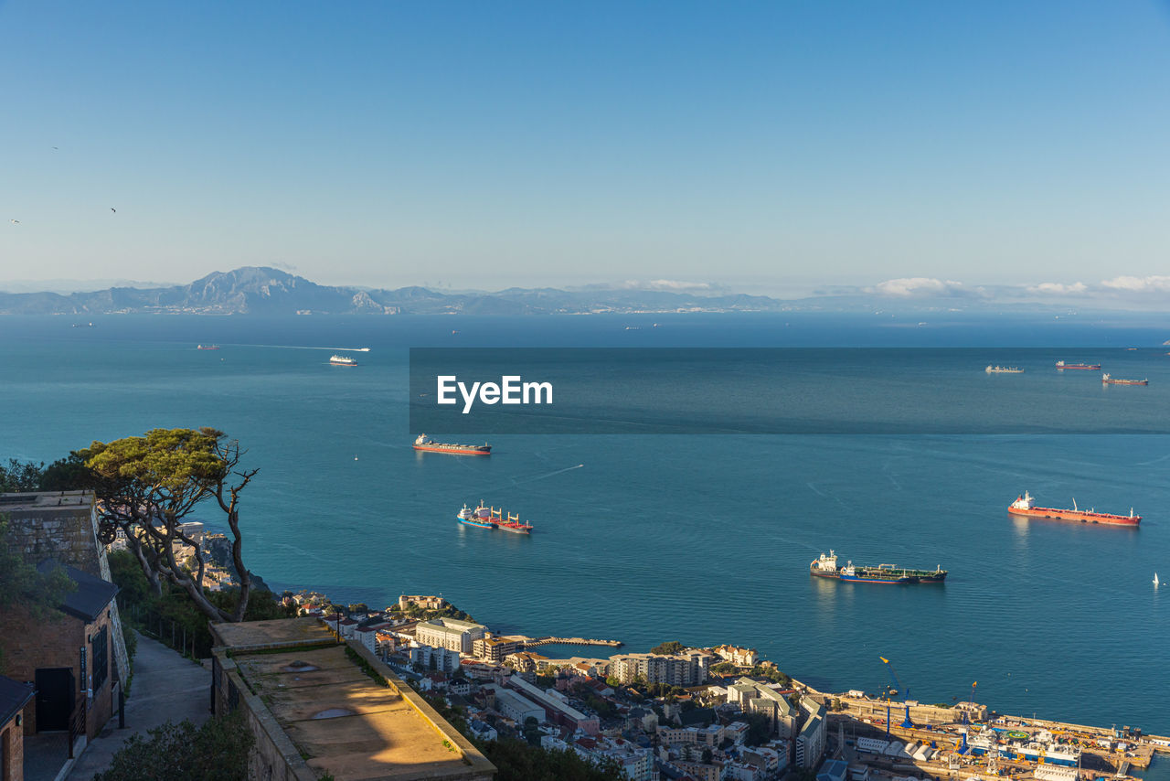 high angle view of sea and buildings against sky