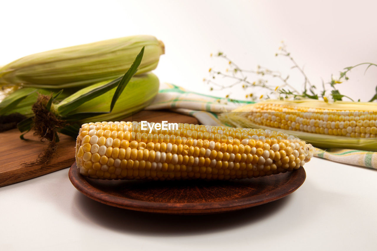 food, food and drink, vegetable, corn, sweet corn, corn kernels, healthy eating, wellbeing, freshness, crop, dish, cereal plant, agriculture, produce, plant, nature, food grain, no people, organic, raw food, vegetarian food, yellow, seed, indoors, studio shot, cuisine