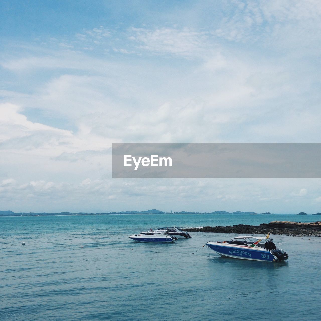 Boats moored in sea