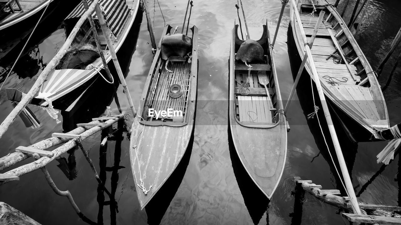 High angle view of fishing boats moored at harbor