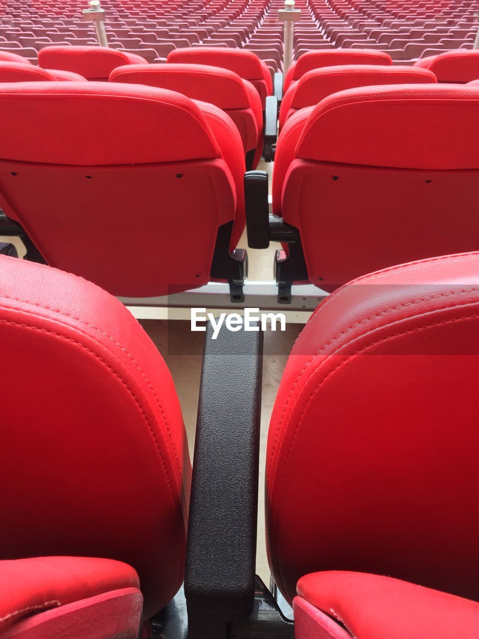 Close-up of empty seats in stadium