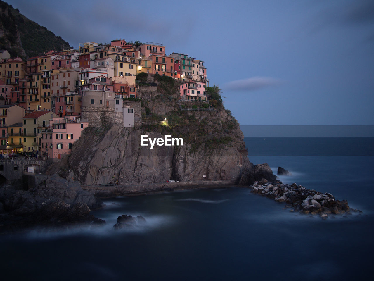 Panoramic view of sea and buildings against sky