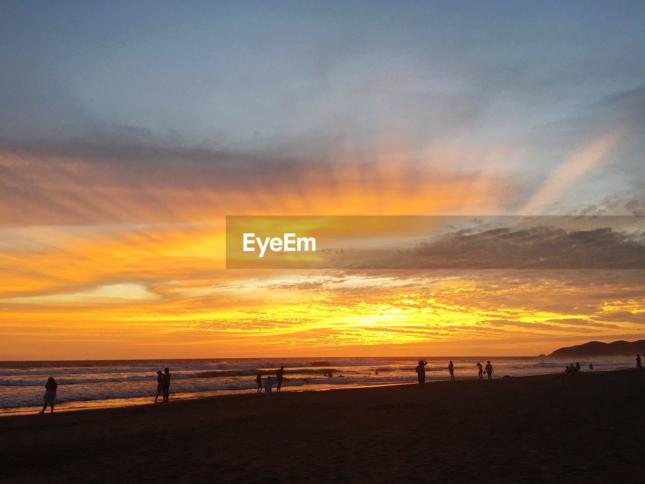 SCENIC VIEW OF BEACH AGAINST SKY DURING SUNSET