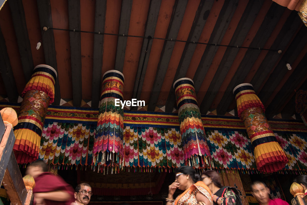 GROUP OF PEOPLE IN TRADITIONAL BUILDING