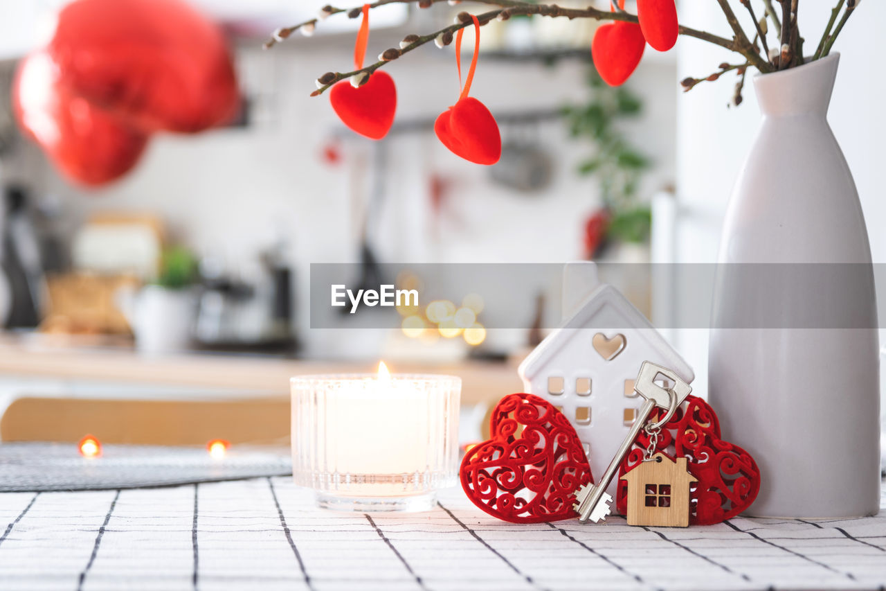 holiday, celebration, decoration, red, christmas, nature, plant, no people, food and drink, christmas decoration, table, tree, food, flower, indoors, home interior, tradition, candle, still life, christmas ornament, domestic room, event, fruit, gift, winter, vase, domestic life, lifestyles