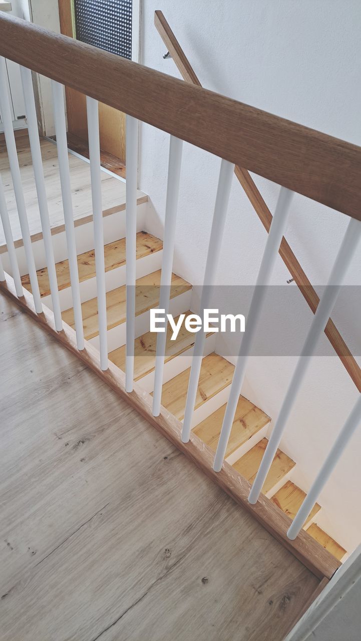 handrail, stairs, architecture, indoors, railing, hardwood, wood, baluster, flooring, home interior, floor, staircase, built structure, hardwood floor, no people, steps and staircases, building, home ownership, high angle view, laminate flooring, home improvement, wood flooring, diy, house, furniture