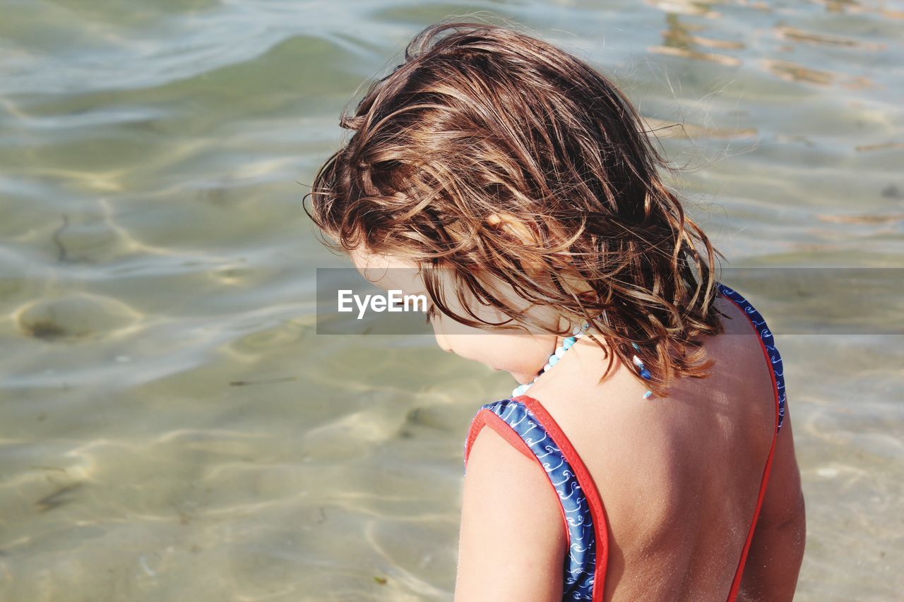 Girl standing at beach