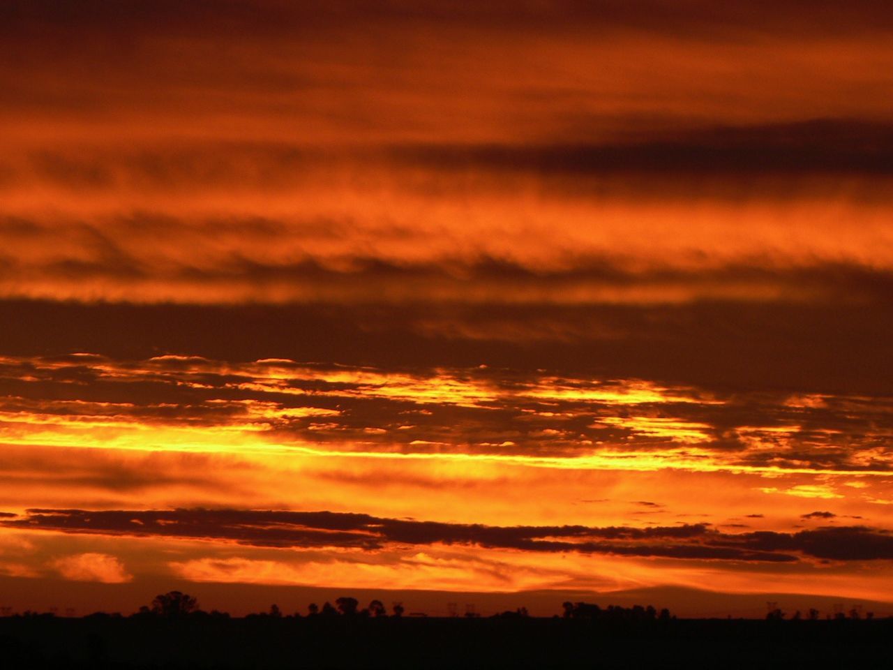 SILHOUETTE OF CLOUDS OVER SEA