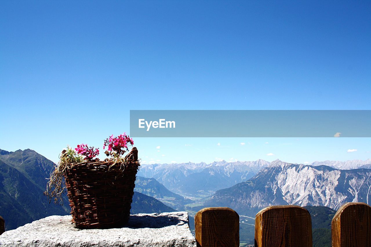 Scenic view of mountains against clear blue sky