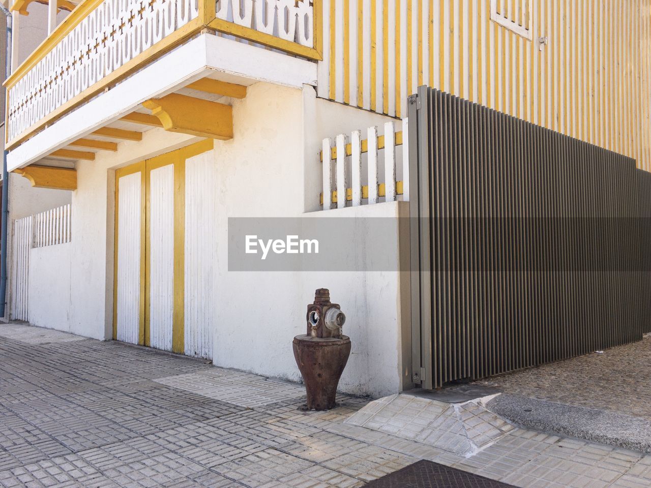 Building in portuguese coastal town and fire hydrant 