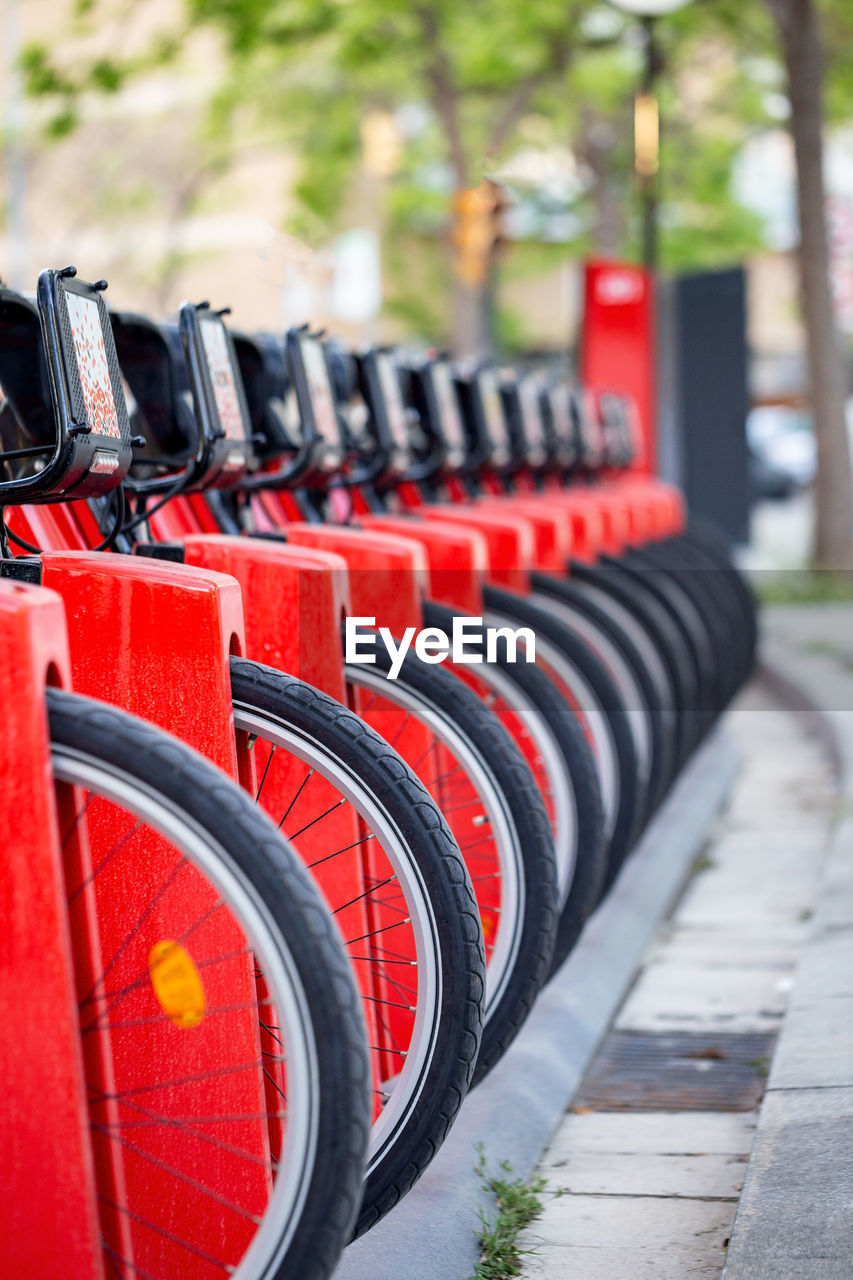 Close-up of bicycles parked at station