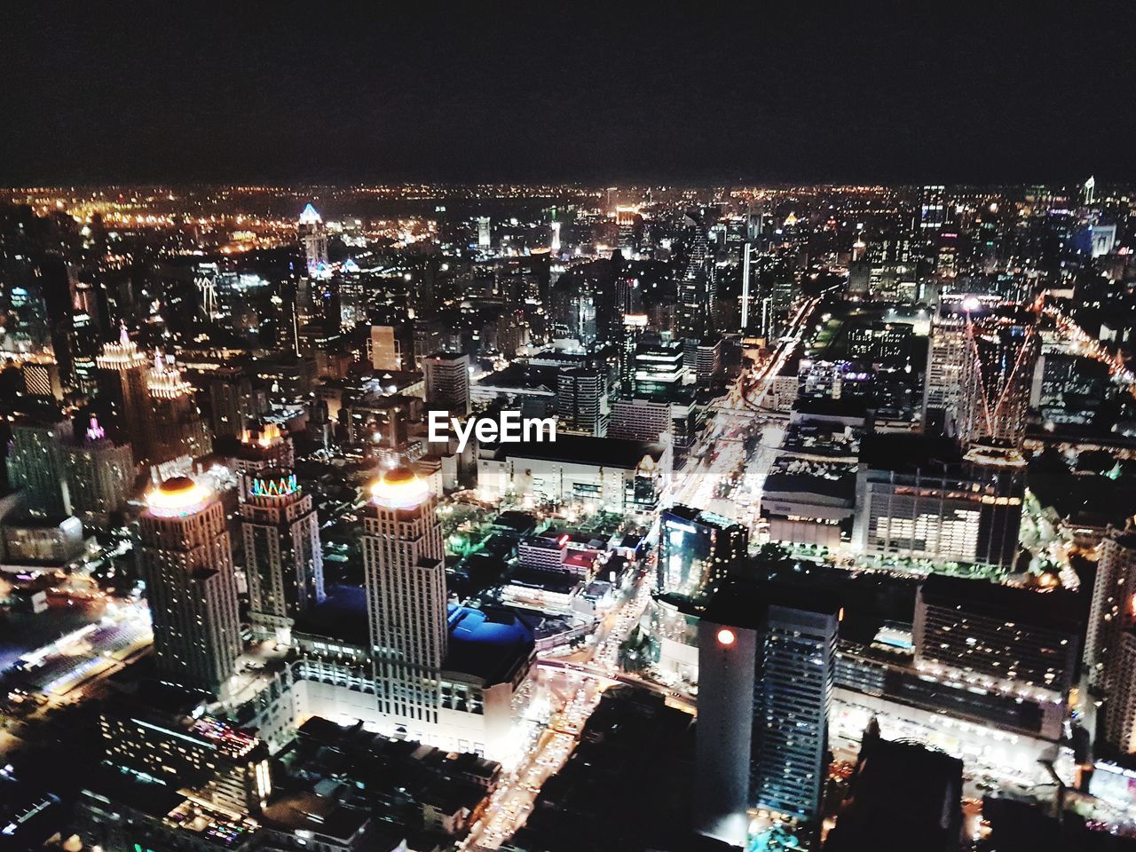 AERIAL VIEW OF ILLUMINATED CITY