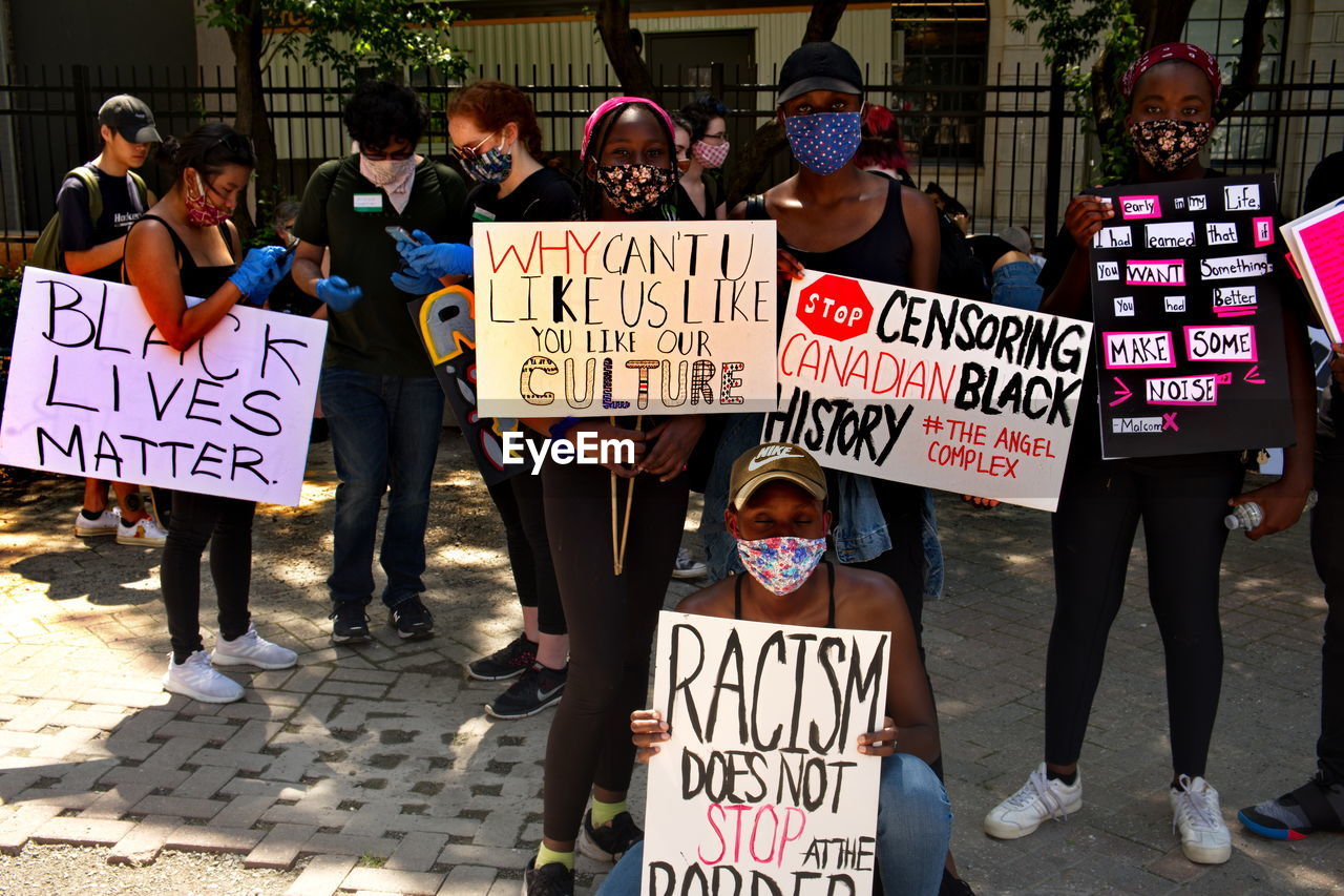 PEOPLE ON STREET AGAINST CITY