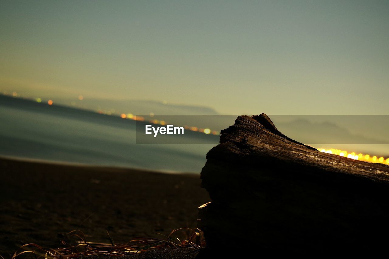 CLOSE-UP OF SEA AGAINST SKY DURING SUNSET