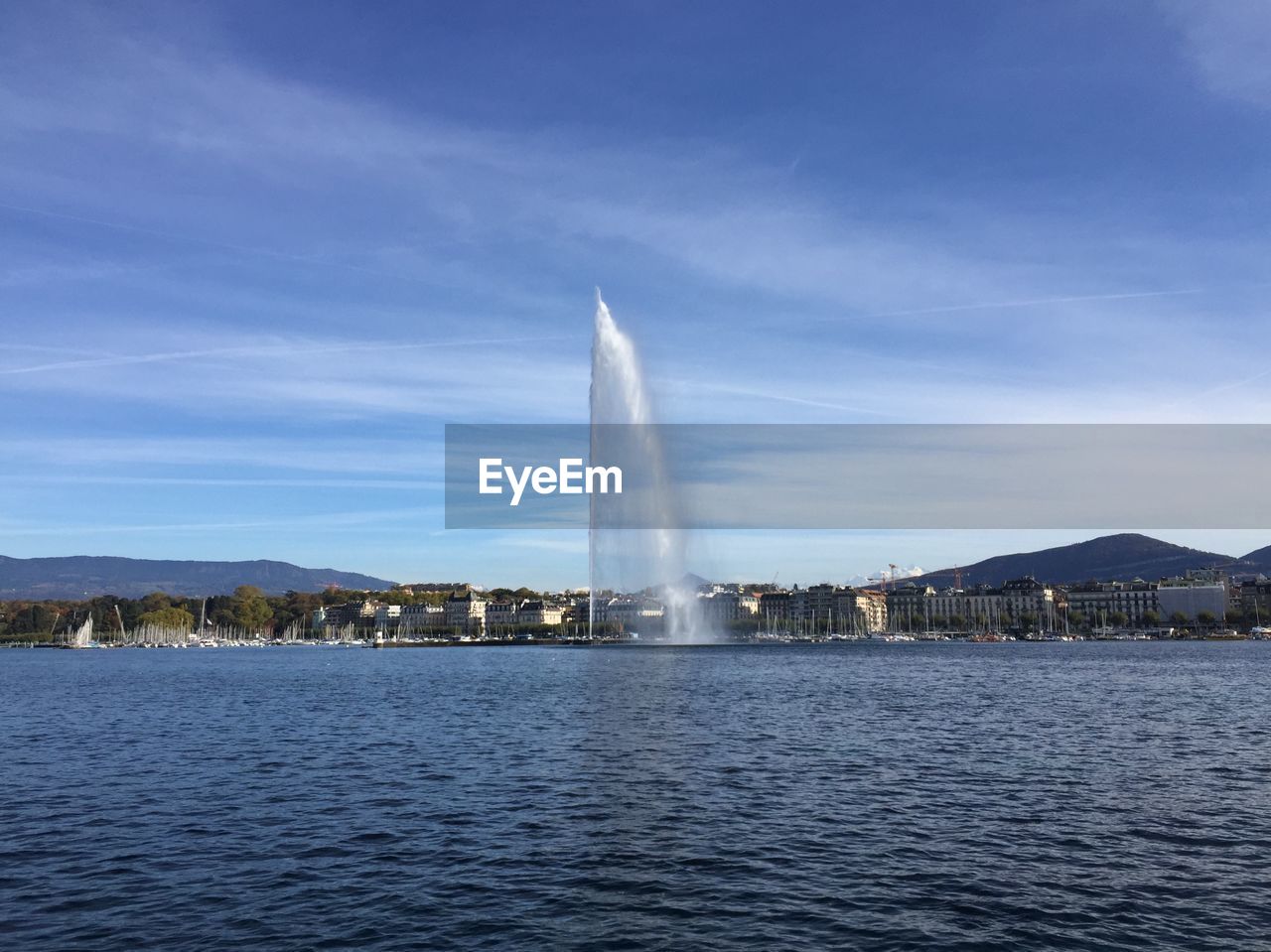 FOUNTAIN AGAINST BLUE SKY